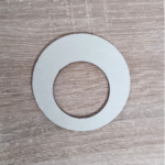 A plywood ring placed on a wooden surface