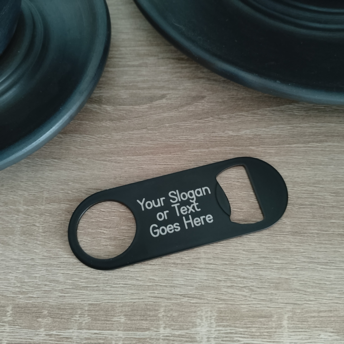 Custom slogan engraved bottle opener on table