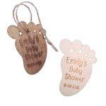 Set of oak-stained and unfinished wooden baby footprint tags with engraved name and date.