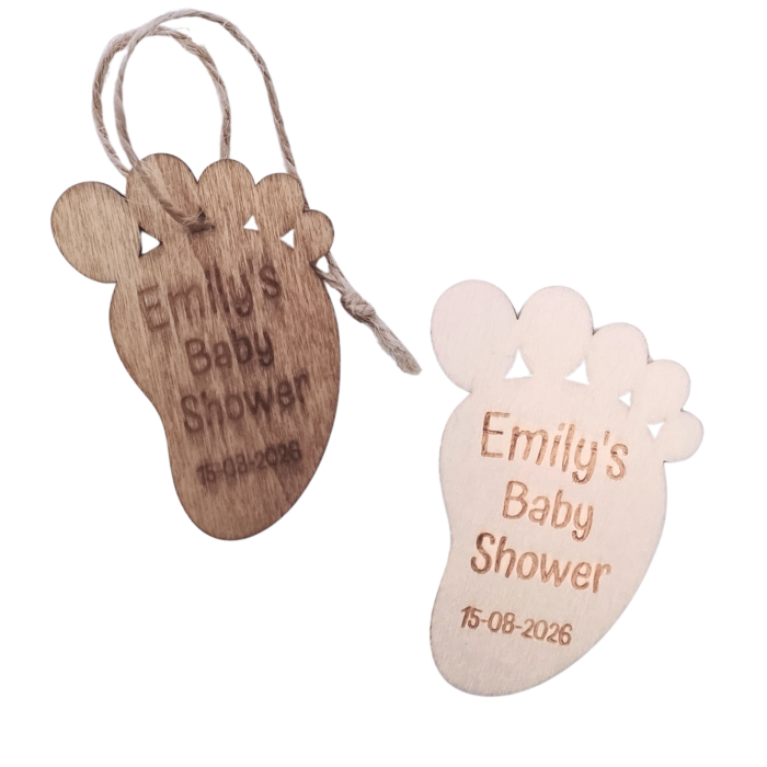Set of oak-stained and unfinished wooden baby footprint tags with engraved name and date.