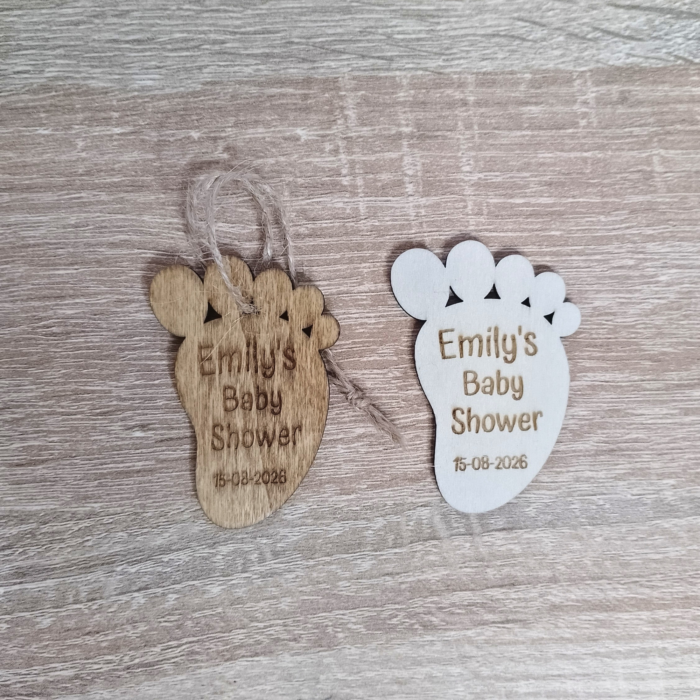 Side-by-side comparison of oak-stained and unfinished wooden baby footprint tags.