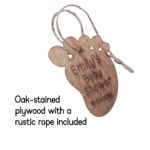 Close-up of a rustic oak-stained wooden footprint tag with personalised engraving.
