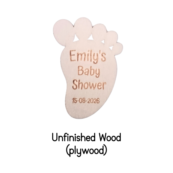 Close-up of an unfinished wooden footprint tag with custom engraving.