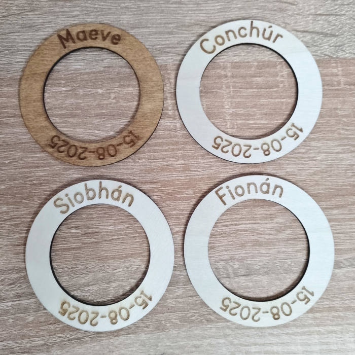 Side-by-side comparison of rustic oak-stained and minimalist unfinished wood napkin rings.